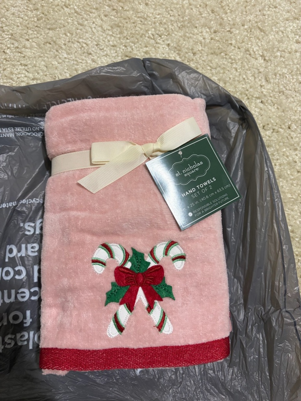 St. Nicholas Square Pink Hand Towel with Candy Cane Embroidery and Red Trim